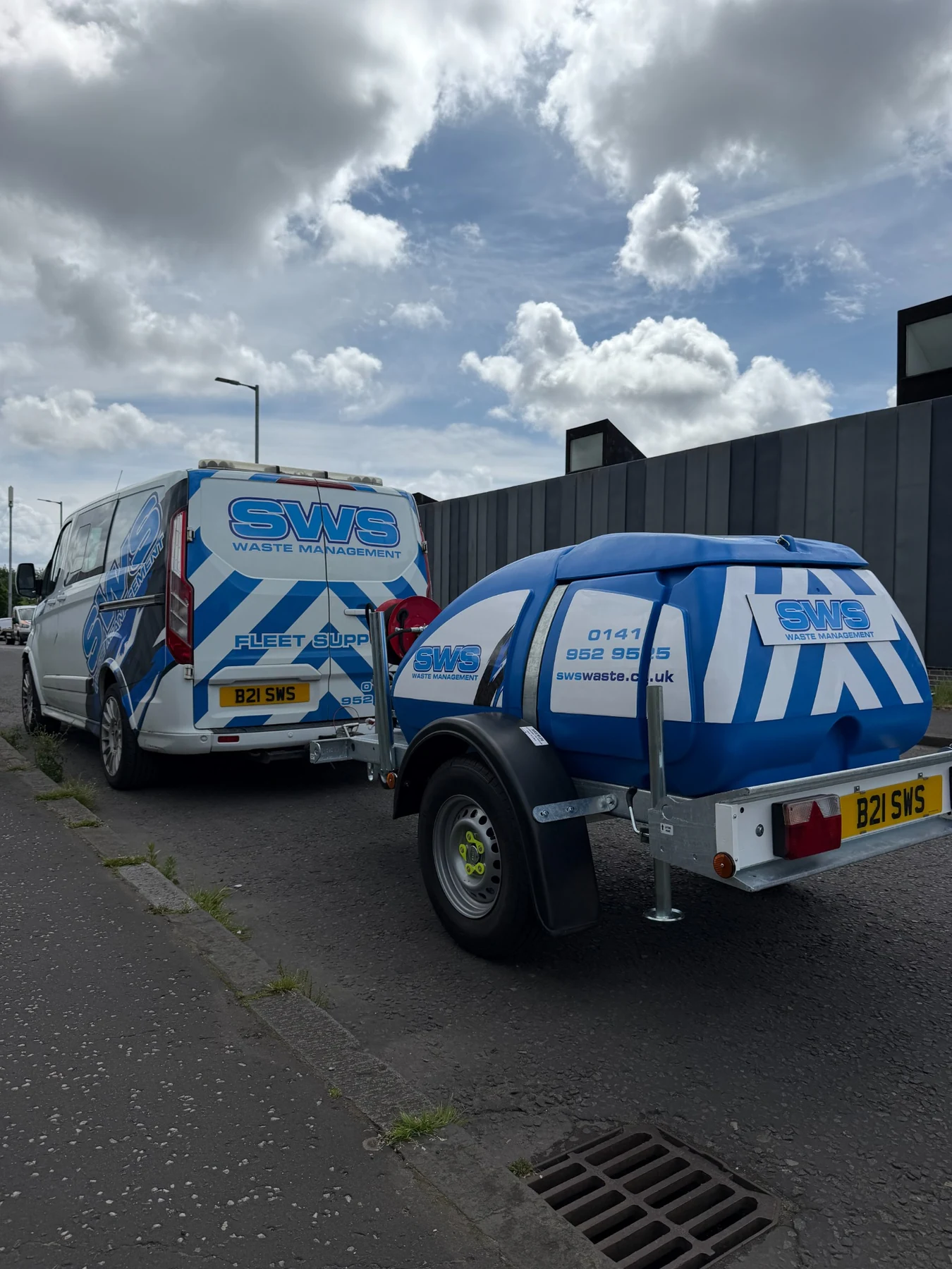 SWS fleet support van towing an industrial cleaning unit